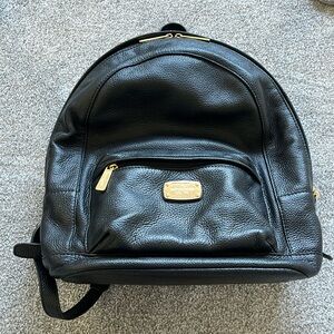 Micheal kors black and gold leather backpack